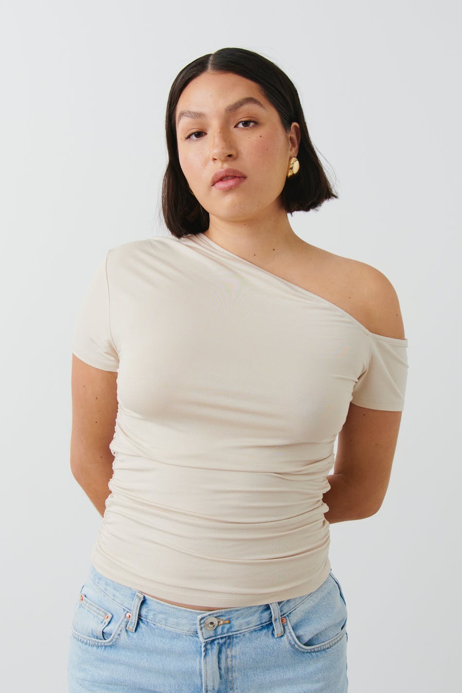 Soft touch asymmetric top - Pumice stone