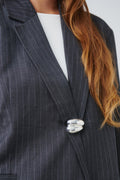Uneven brooch