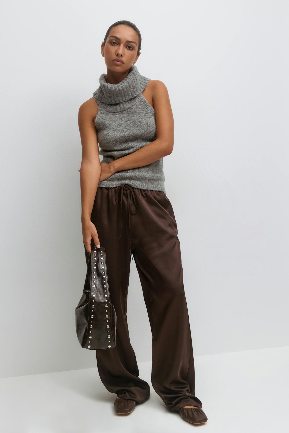 Small slouchy studded bag